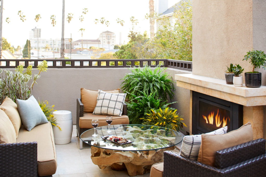 The Ambrose Hotel Room with Outdoor Fireplace and Seating Area