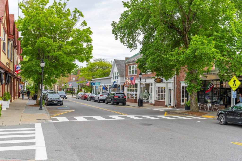 Shops and trees along Main Street in Falmouth, MA