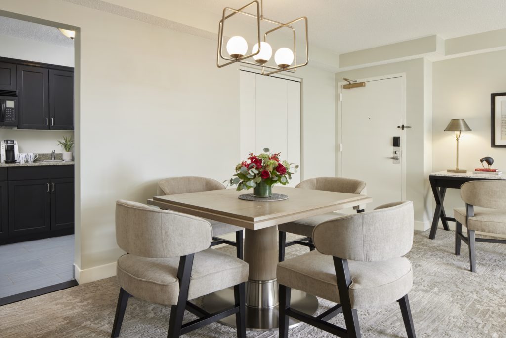 Dining table with four chairs in kitchen in Capitol Hill Hotel suite in Washington, DC