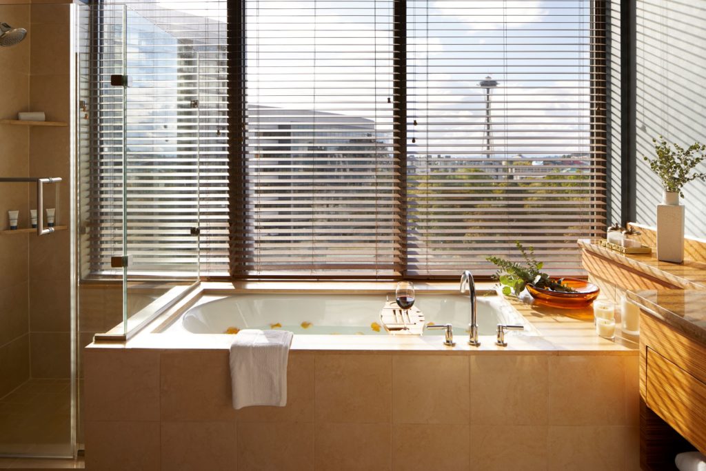 Bathtub with Space Needle view in the Denny Suite at Pan Pacific Seattle hotel.