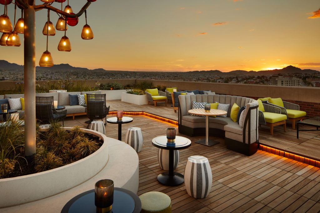 North terrace of La Perla Rooftop at The Plaza Hotel Pioneer Park with sunset in background