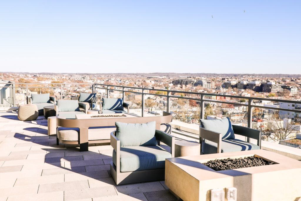 seats and fire pits with a panoramic view of DC at Upstairs at The Morrow