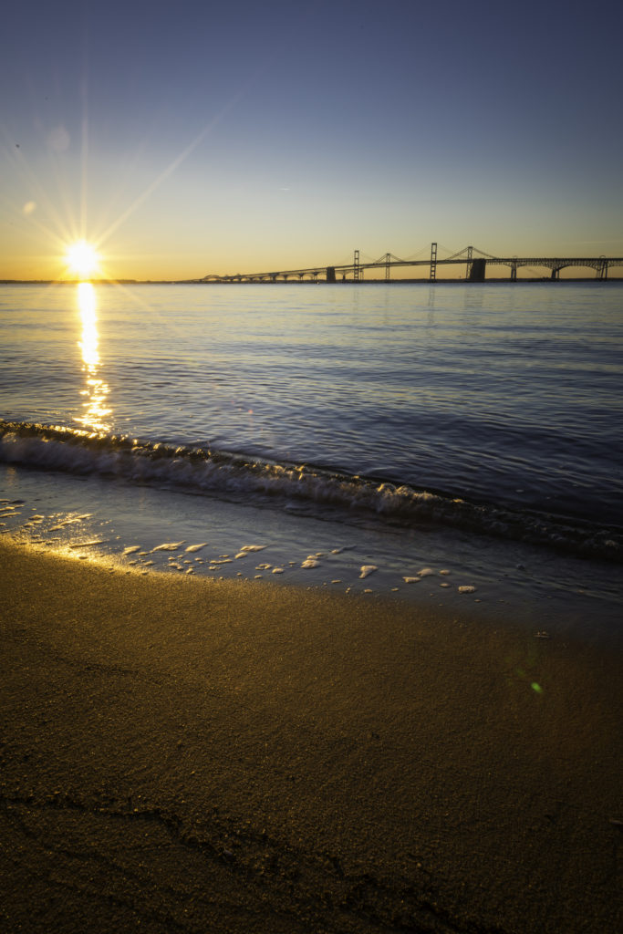 The sunrises over the Chesapeake Bay Bridge.