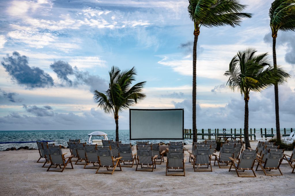 Outdoor movie screen and chairs on the beach at Islander Resort in Islamorada